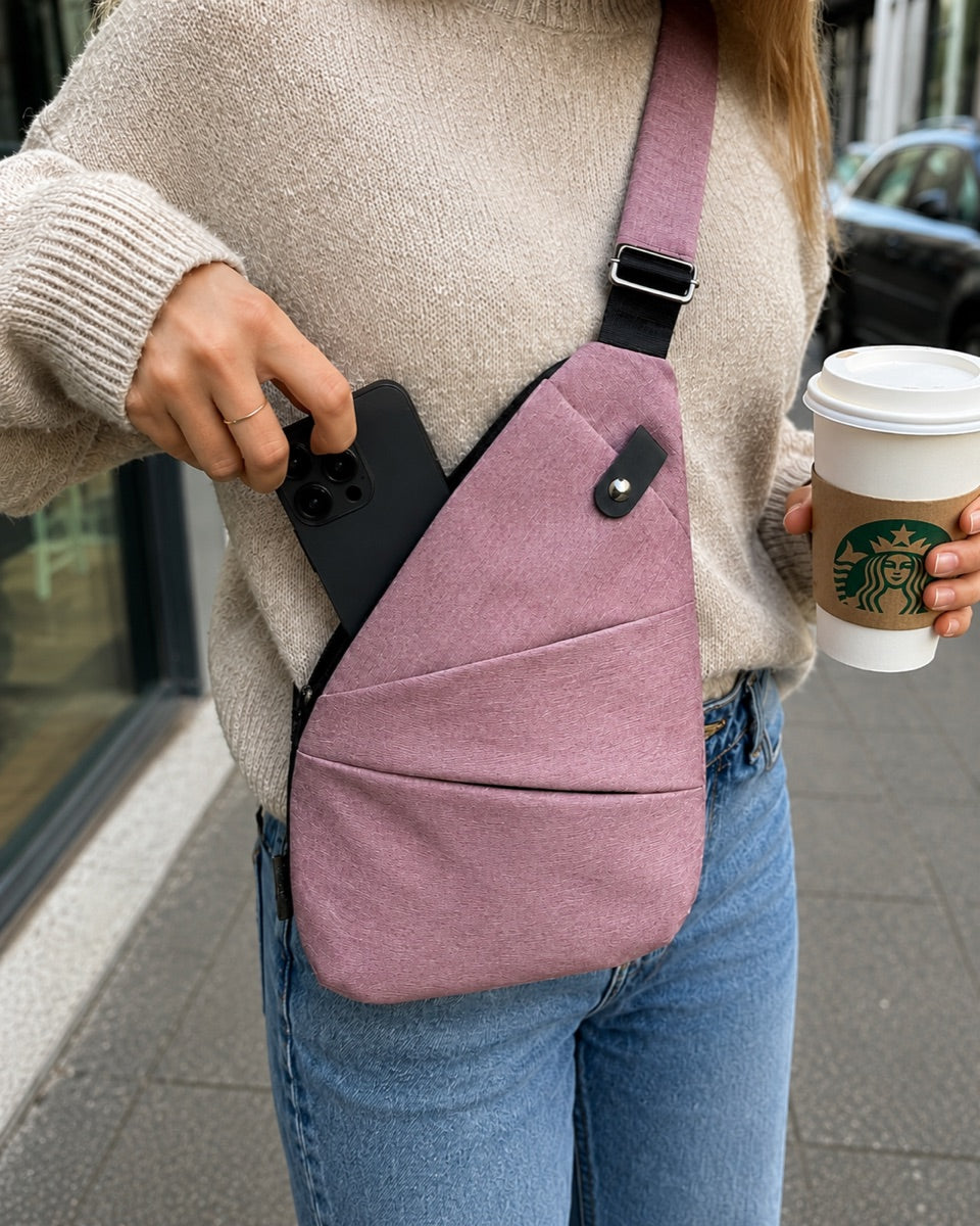 Grabbing a phone one-handed from the Valrenn bag while holding a coffee